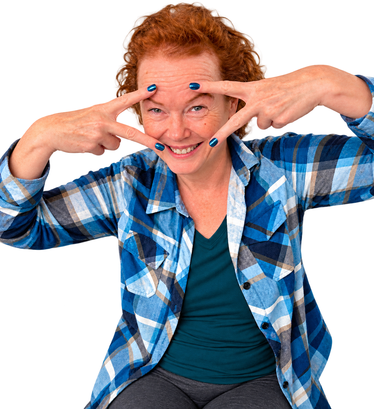 Sandy smiling playfully with her hands framing her face